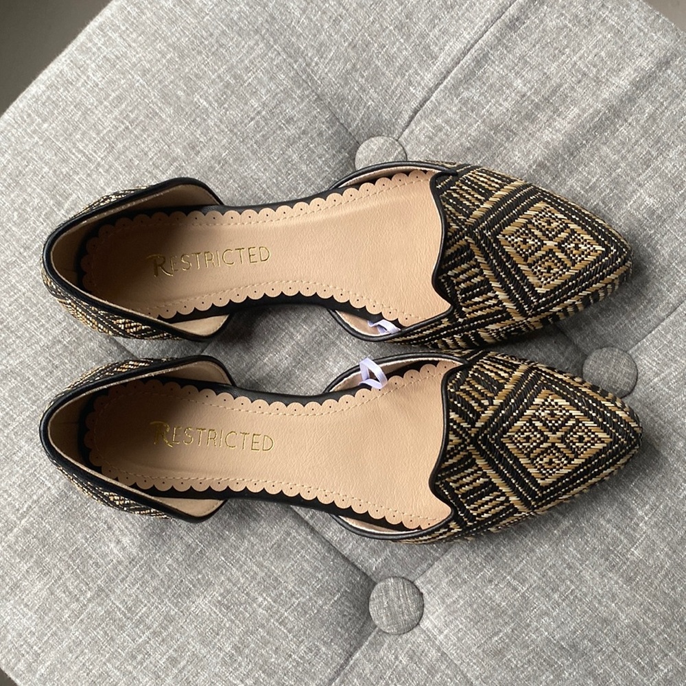 Black and tan woven flats. Size 7. Never worn.